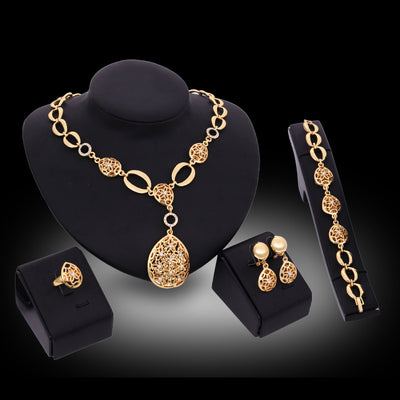 Stylish Four Piece Jewelry Set for Women: Alloy Material, Diamond Processing, Bamboo Link Chain, Love/Water Drop/Bell Design, 18k/61154132 Color. Includes Earrings, Necklaces, and Bracelets.