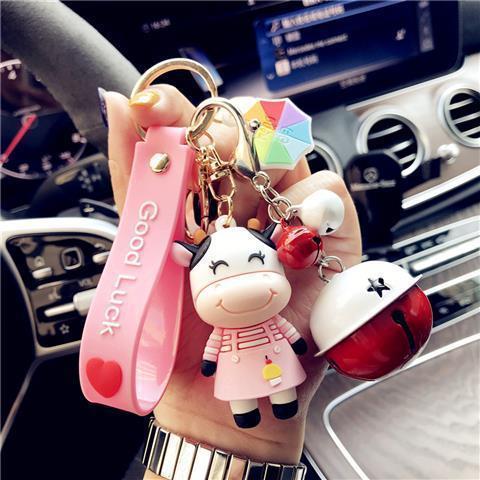 Adorable Pastoral Style Cow Keychain - Trending Pink Dad & Mom Designs with Bell Accent - Made of PVC Material - Includes 1 Keychain