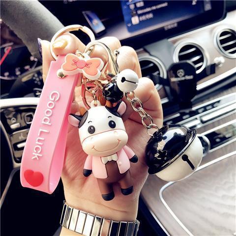 Adorable Pastoral Style Cow Keychain - Trending Pink Dad & Mom Designs with Bell Accent - Made of PVC Material - Includes 1 Keychain